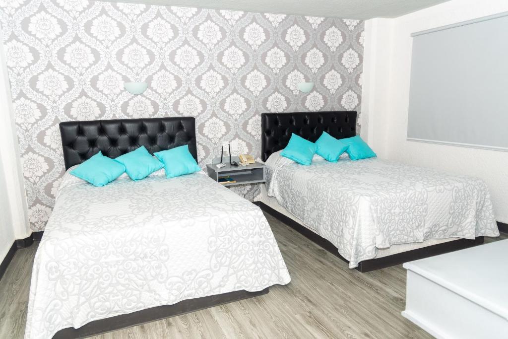 Postel nebo postele na pokoji v ubytování Hotel Kyrios Veracruz