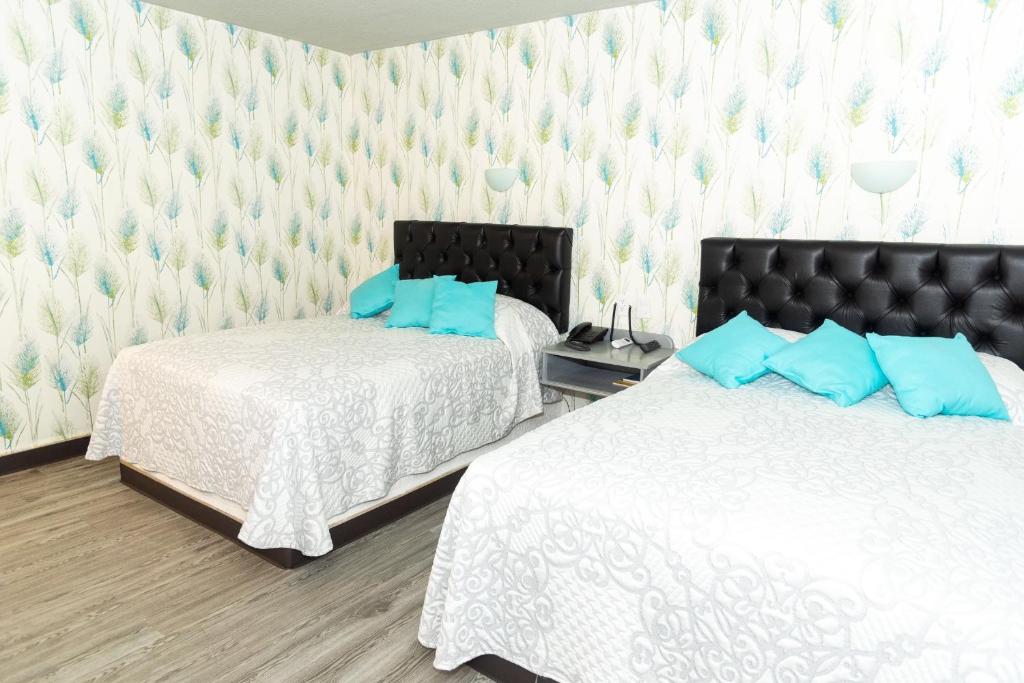 Postel nebo postele na pokoji v ubytování Hotel Kyrios Veracruz