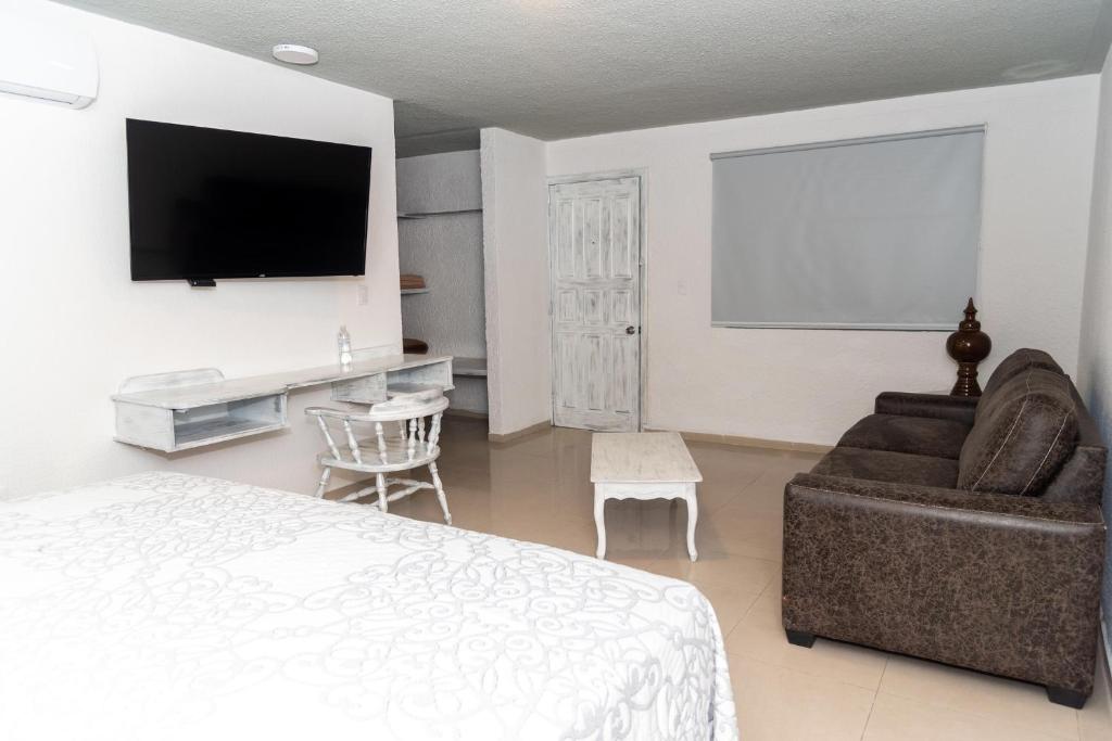 TV a/nebo společenská místnost v ubytování Hotel Kyrios Veracruz