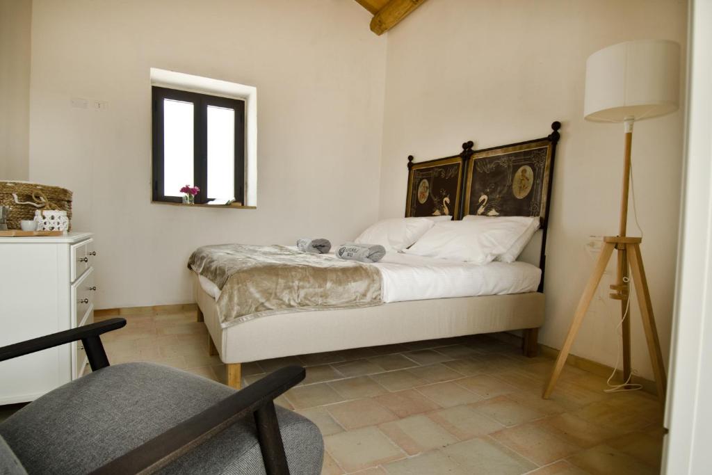 Postel nebo postele na pokoji v ubytování Kapuhala Sicily