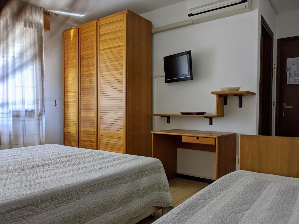 Postel nebo postele na pokoji v ubytování Hotel Corallo