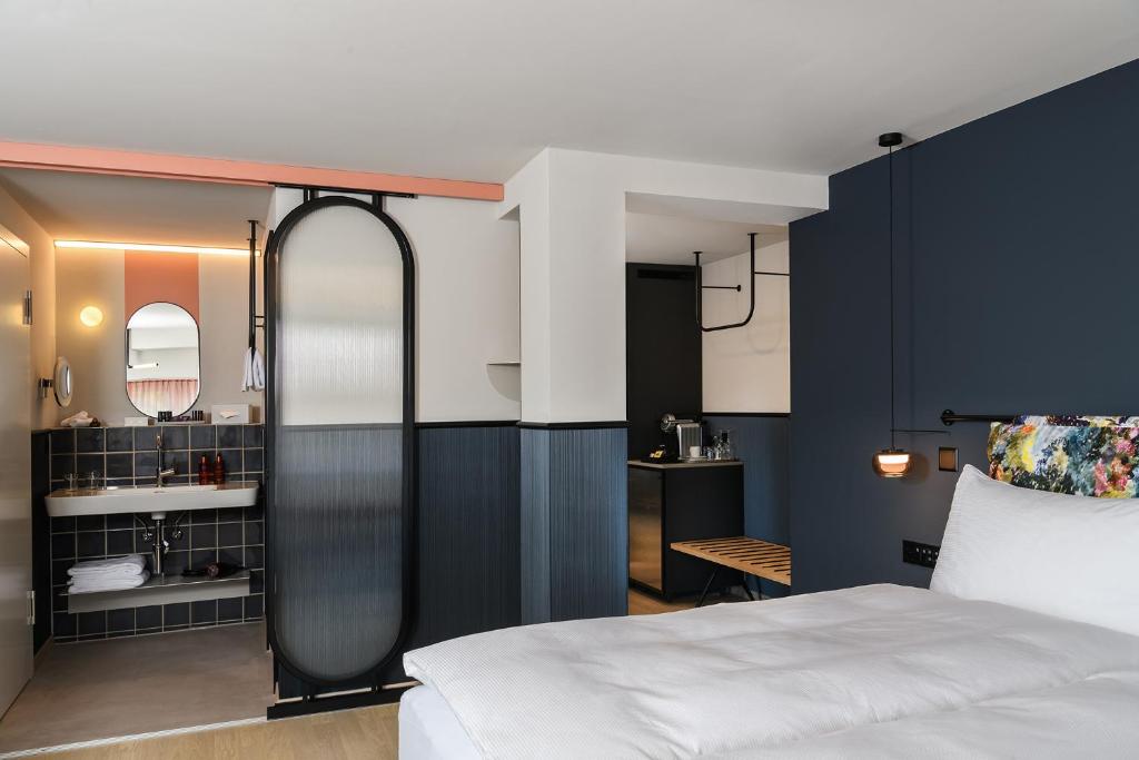 Postel nebo postele na pokoji v ubytování Sorell Hotel City Weissenstein - Boutique Hotel