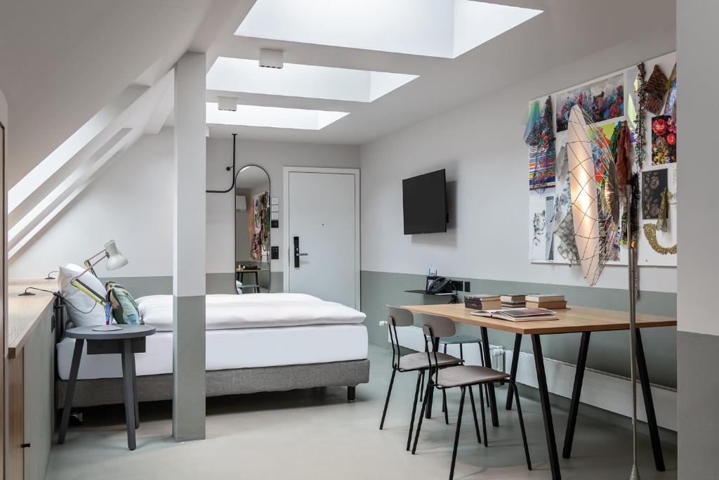 Postel nebo postele na pokoji v ubytování Sorell Hotel City Weissenstein - Boutique Hotel