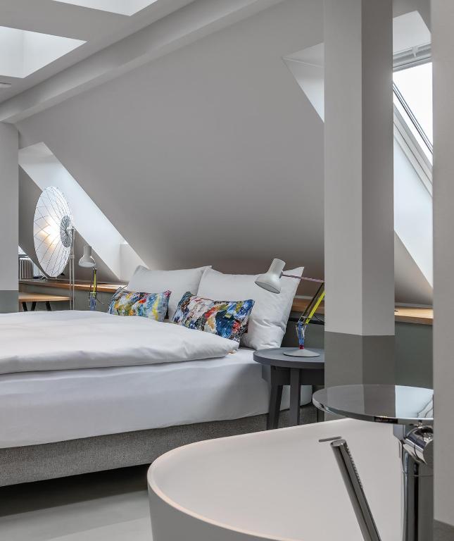 Postel nebo postele na pokoji v ubytování Sorell Hotel City Weissenstein - Boutique Hotel