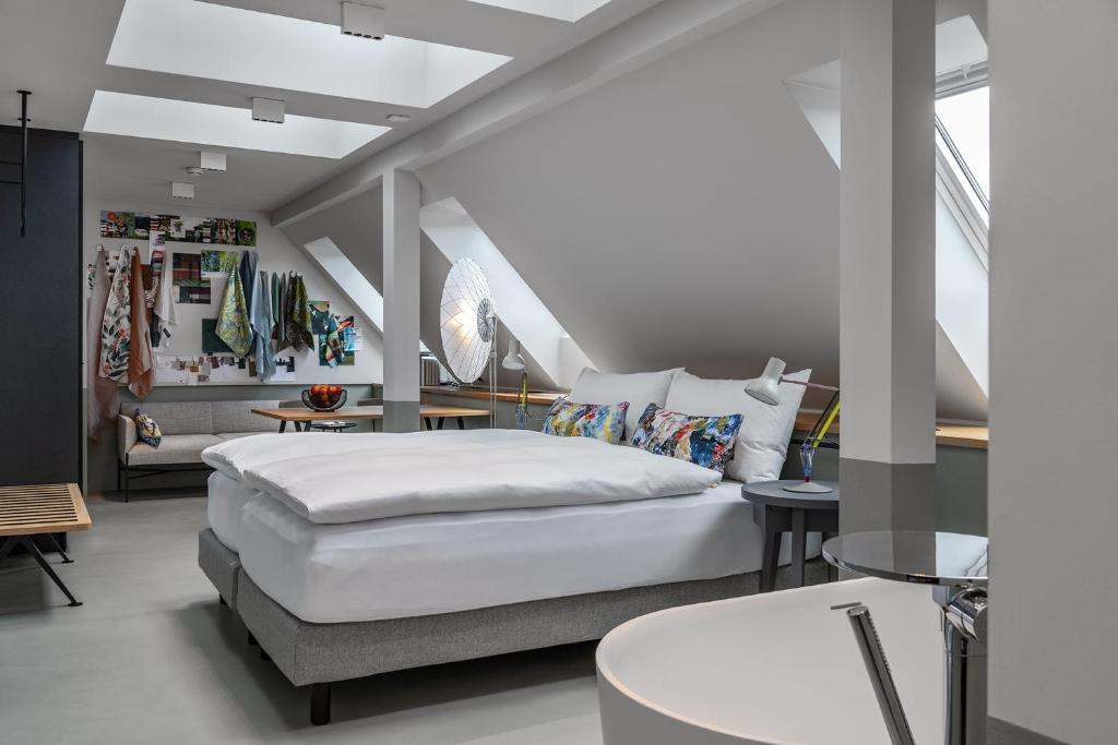 Postel nebo postele na pokoji v ubytování Sorell Hotel City Weissenstein - Boutique Hotel
