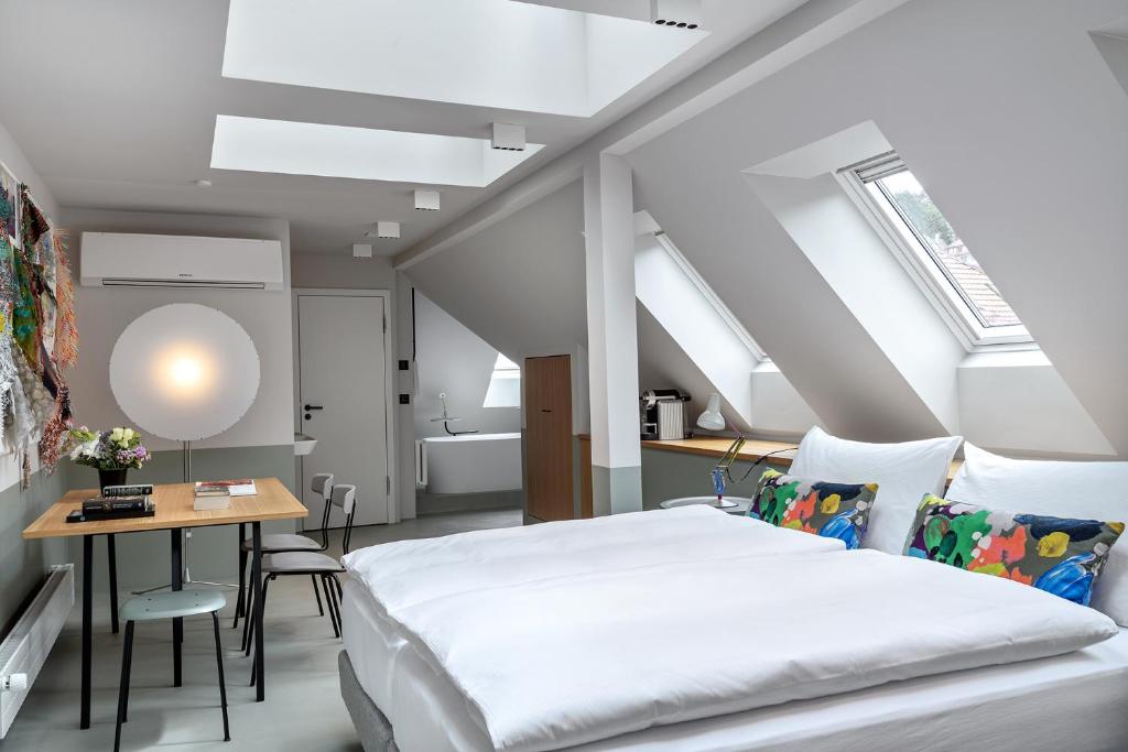 Postel nebo postele na pokoji v ubytování Sorell Hotel City Weissenstein - Boutique Hotel