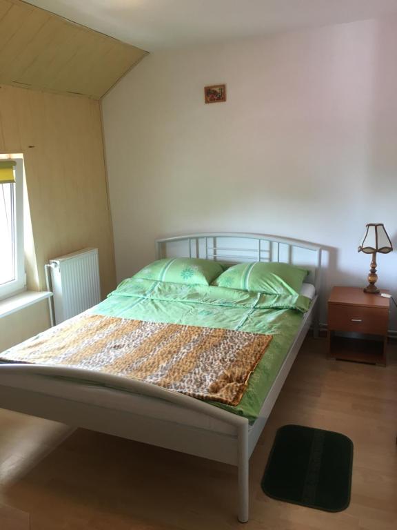 Postel nebo postele na pokoji v ubytování Dom Jana