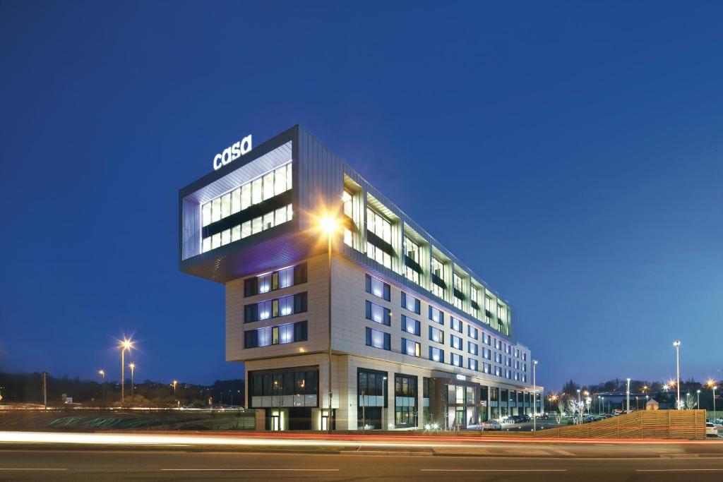 a building with a sign on the side of it at Casa Hotel in Chesterfield