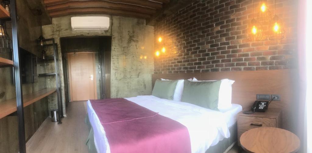 Postel nebo postele na pokoji v ubytování Meydan Besiktas Hotel