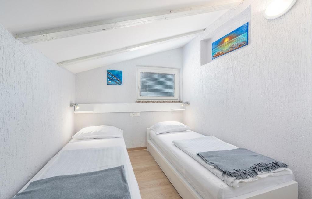 Postel nebo postele na pokoji v ubytování Apartment Vilma Funtana
