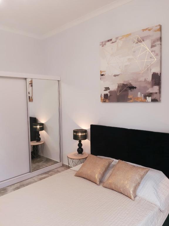 Postel nebo postele na pokoji v ubytování Na Grobli 20 Apartament z ogródkiem
