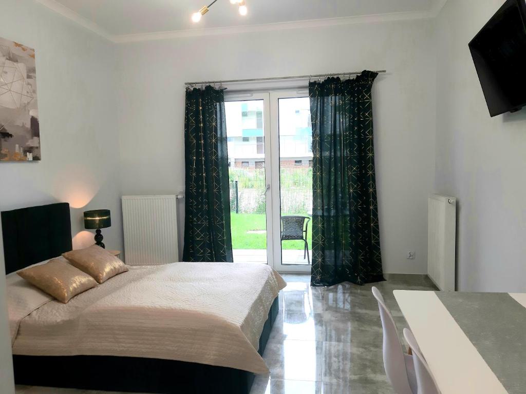 Postel nebo postele na pokoji v ubytování Na Grobli 20 Apartament z ogródkiem