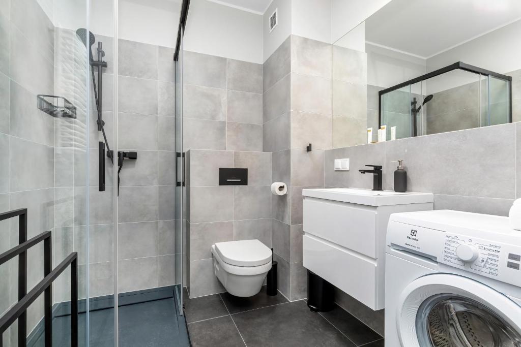 Kúpeľňa v ubytovaní Modern City Center Apartments by Noclegi Renters