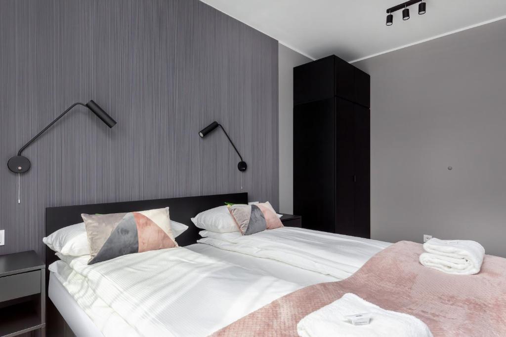 Posteľ alebo postele v izbe v ubytovaní Modern City Center Apartments by Noclegi Renters