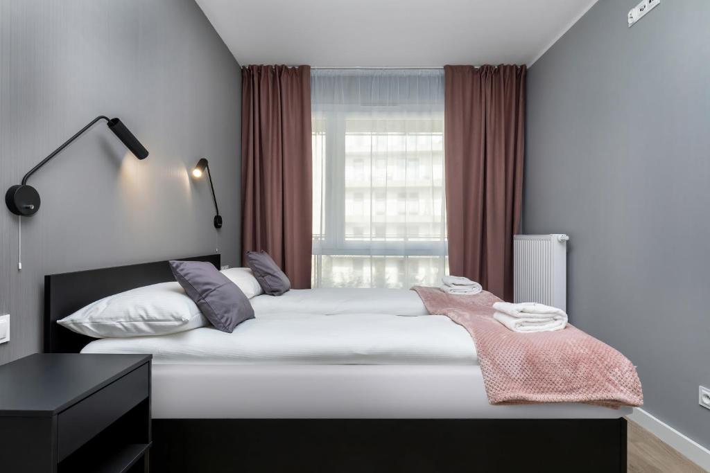Posteľ alebo postele v izbe v ubytovaní Modern City Center Apartments by Noclegi Renters