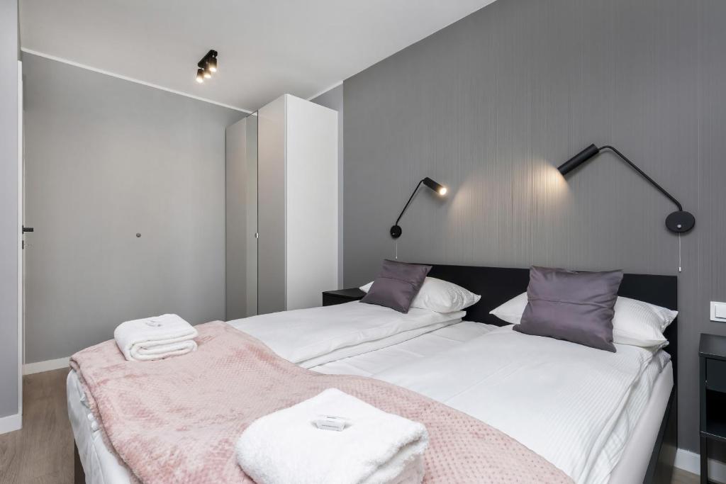 Posteľ alebo postele v izbe v ubytovaní Modern City Center Apartments by Noclegi Renters