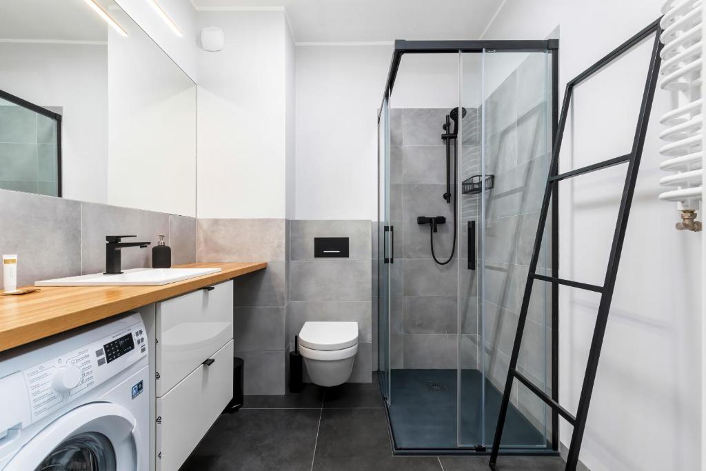 Kúpeľňa v ubytovaní Modern City Center Apartments by Noclegi Renters