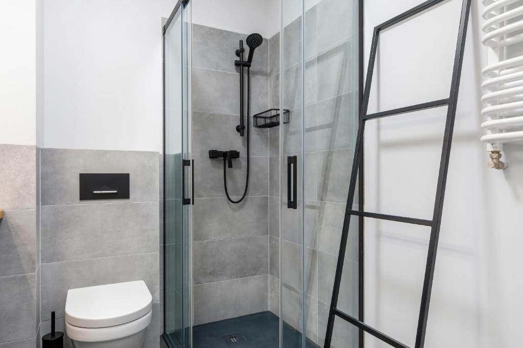 Kúpeľňa v ubytovaní Modern City Center Apartments by Noclegi Renters