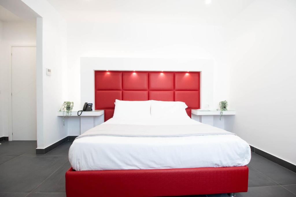 Postel nebo postele na pokoji v ubytování GRAND HOTEL SERAPIDE