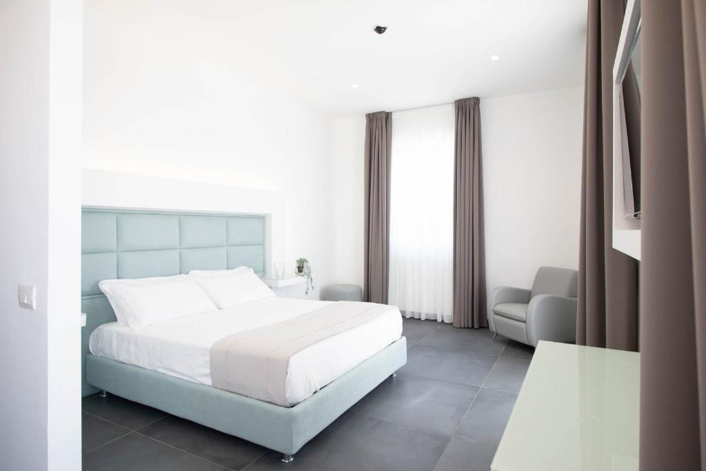 Postel nebo postele na pokoji v ubytování GRAND HOTEL SERAPIDE