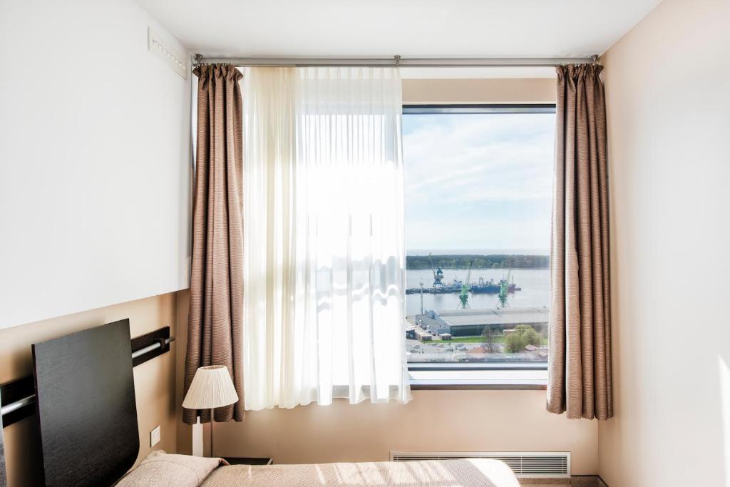 Lova arba lovos apgyvendinimo įstaigoje Amberton Hotel Klaipeda