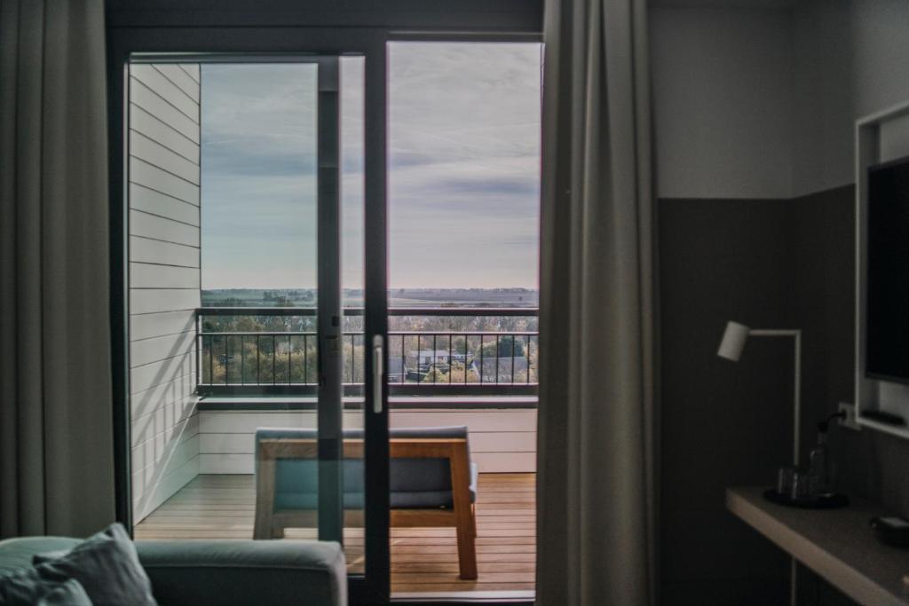 Strandhotelにあるテレビまたはエンターテインメントセンター