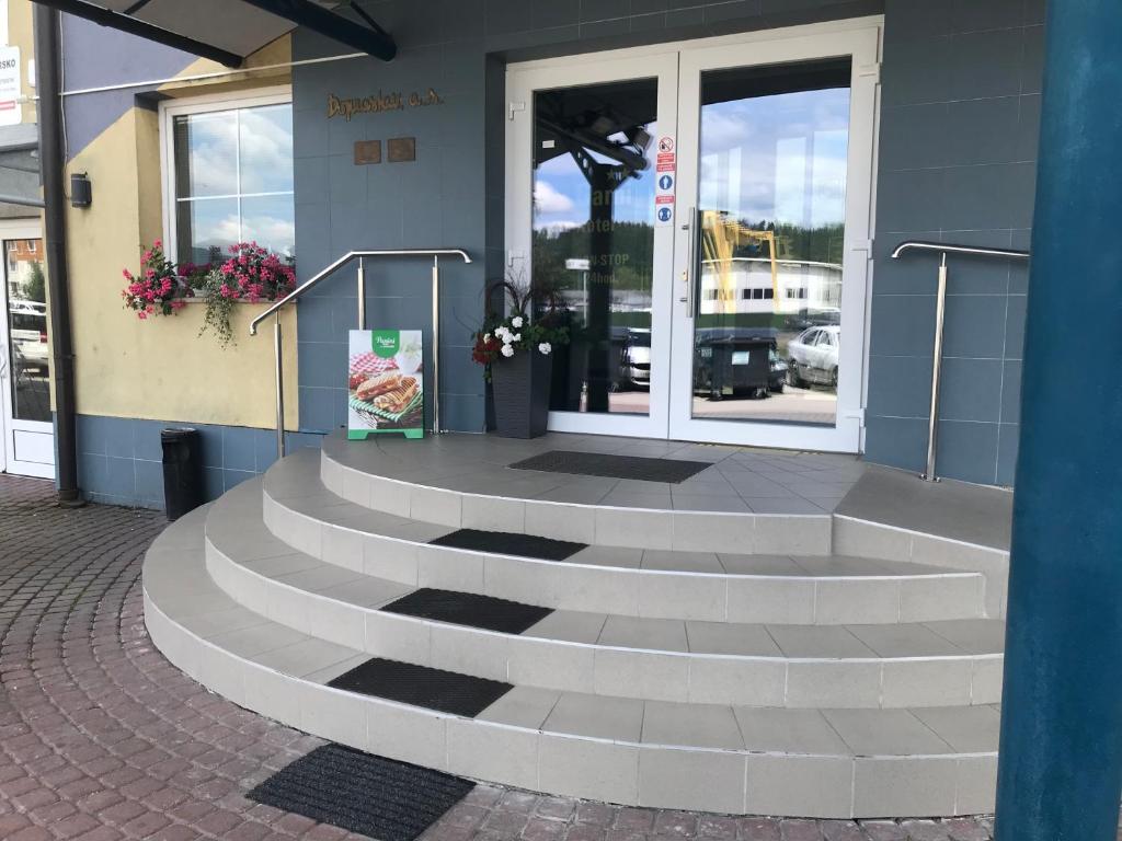 a set of stairs in front of a building at Garni G Hotel Žilina in Žilina