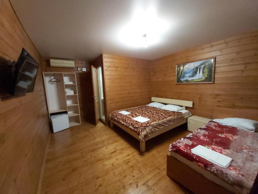 Cama o camas de una habitación en Guest House Miya