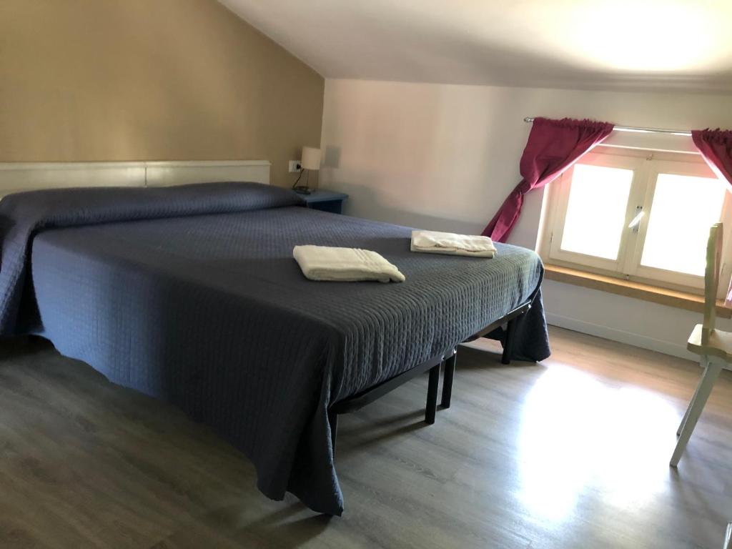 Łóżko lub łóżka w pokoju w obiekcie Corte del Garda Home