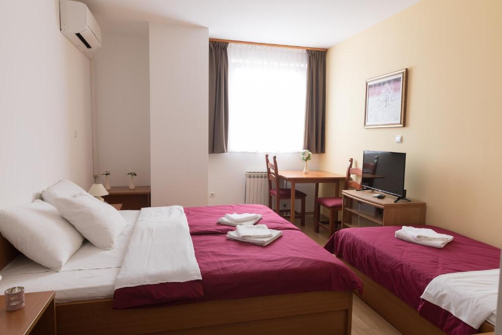 Postel nebo postele na pokoji v ubytování Hotel Klek