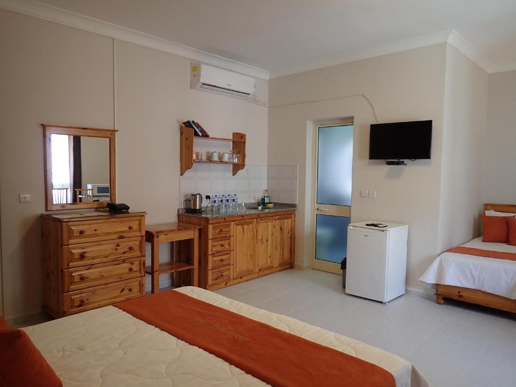 Postel nebo postele na pokoji v ubytování Duncan Guesthouse