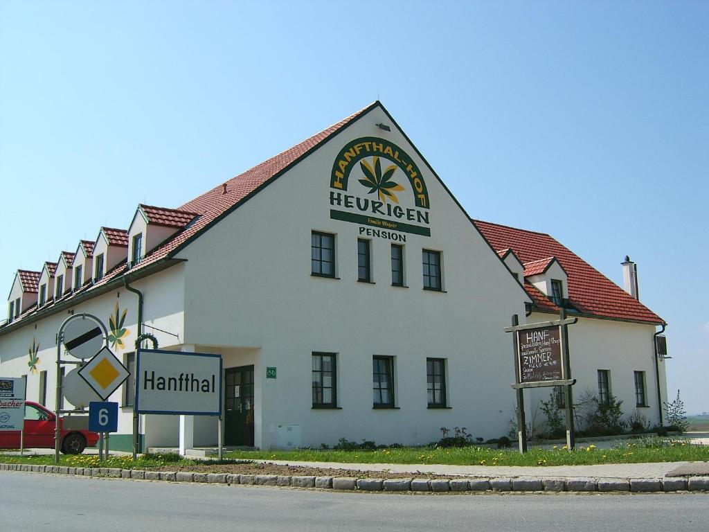 a large white building with a sign on it at Hanfthal-Hof in Laa an der Thaya