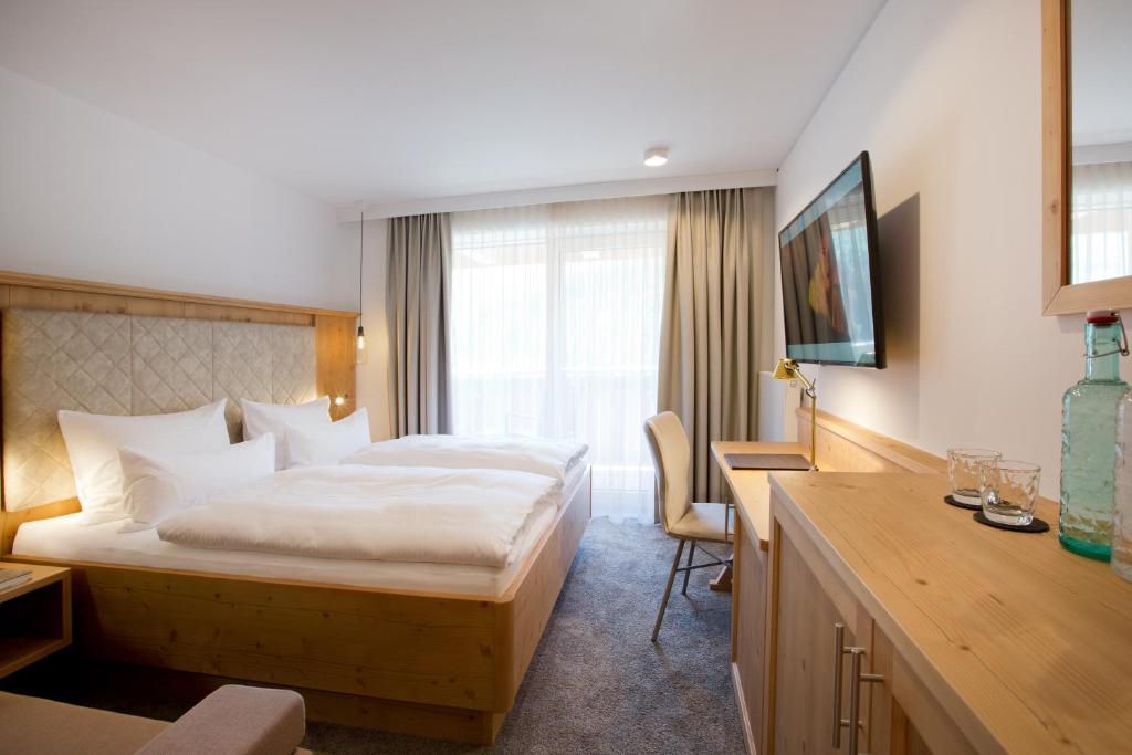 Postel nebo postele na pokoji v ubytování Boutiquehotel Hohes Licht