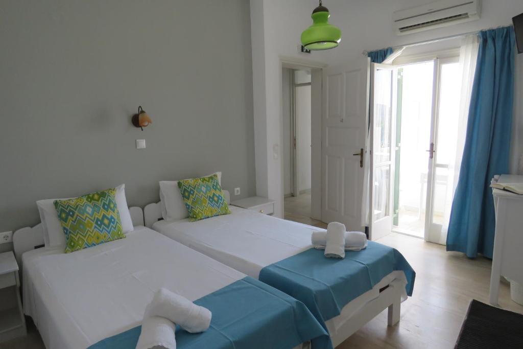 Una cama o camas en una habitación de Corali Beach Hotel
