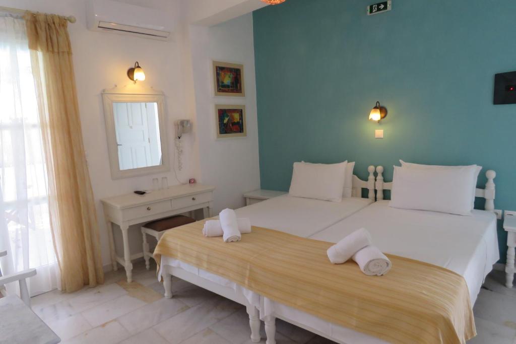 Una cama o camas en una habitación de Corali Beach Hotel