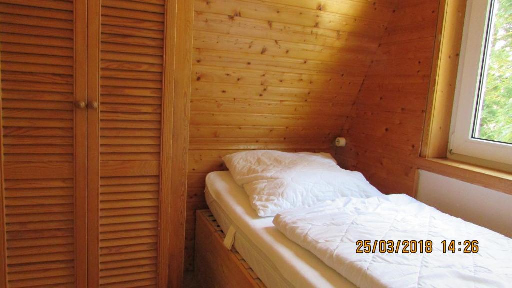 Postel nebo postele na pokoji v ubytování Finnhaus Neubauer
