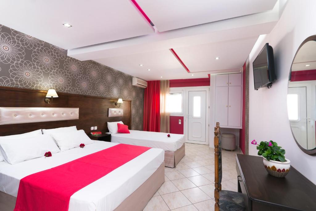 Łóżko lub łóżka w pokoju w obiekcie Hotel Asterias