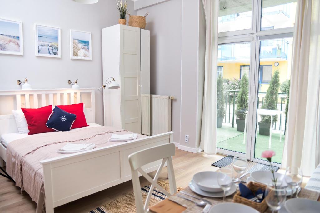 Postel nebo postele na pokoji v ubytování Portofino Seaside Apartments