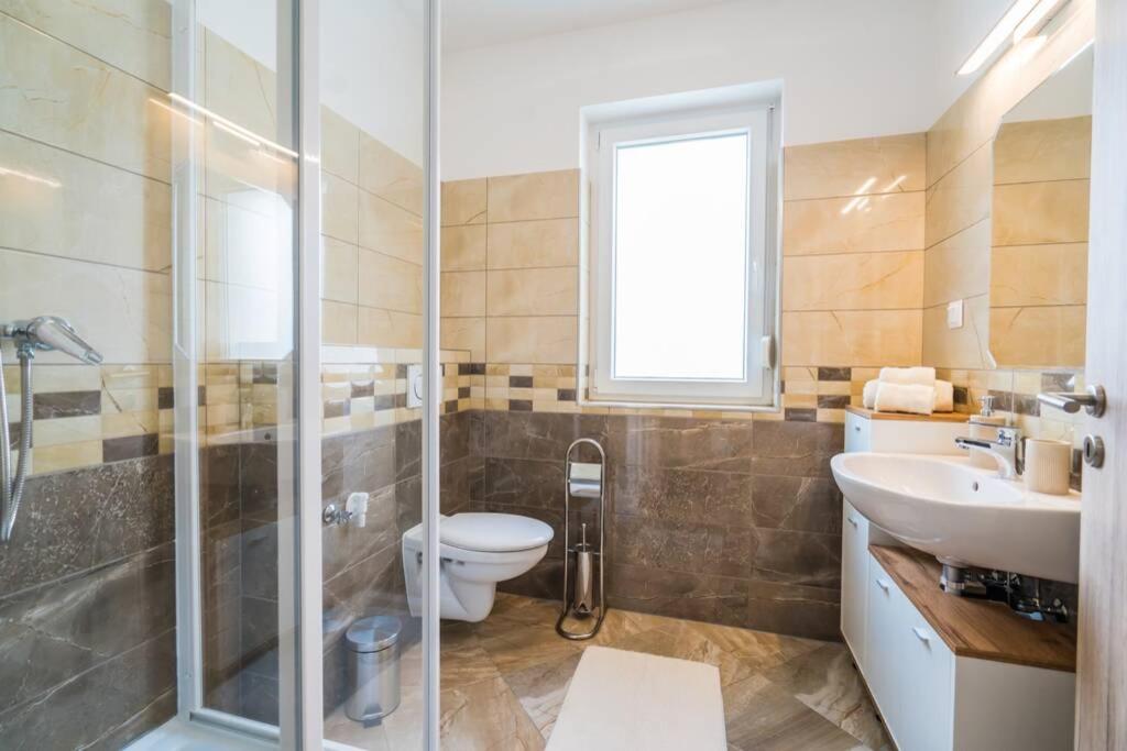 Kúpeľňa v ubytovaní Gemini Apartments II