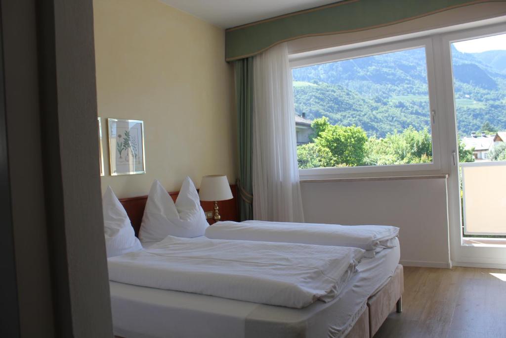 Postel nebo postele na pokoji v ubytování Hotel Annabell