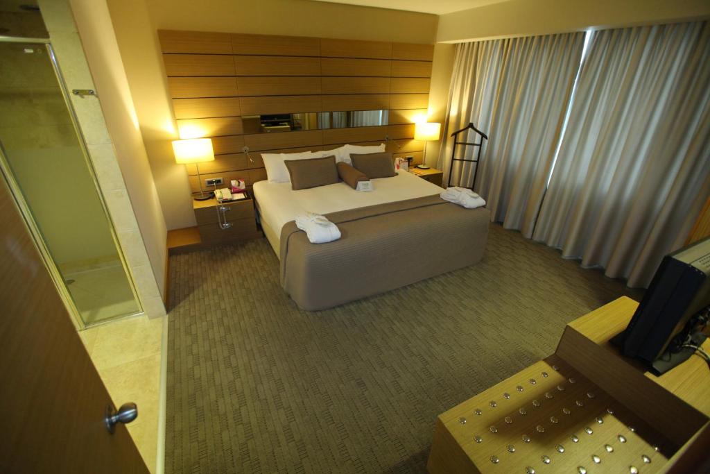 Postel nebo postele na pokoji v ubytování CPAnkara Hotel