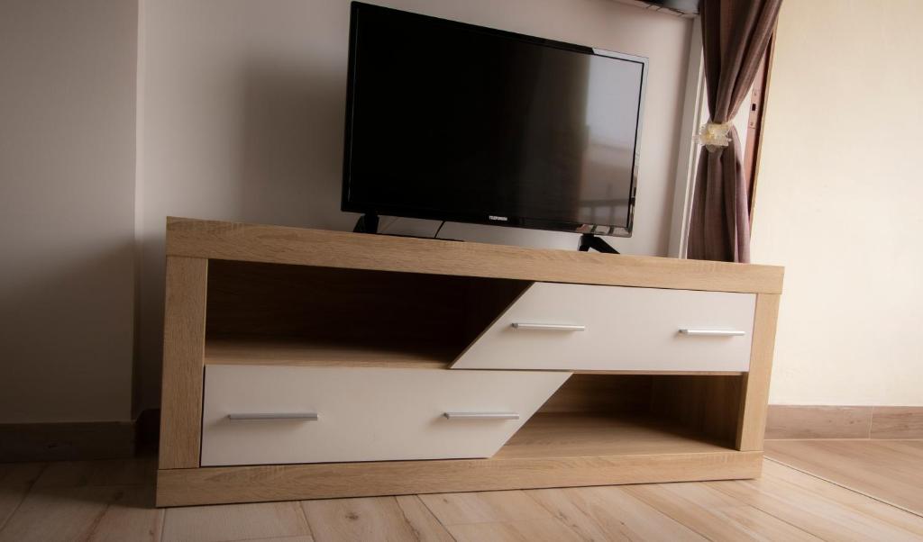 TV a/nebo společenská místnost v ubytování EL CARMEN beach apartment