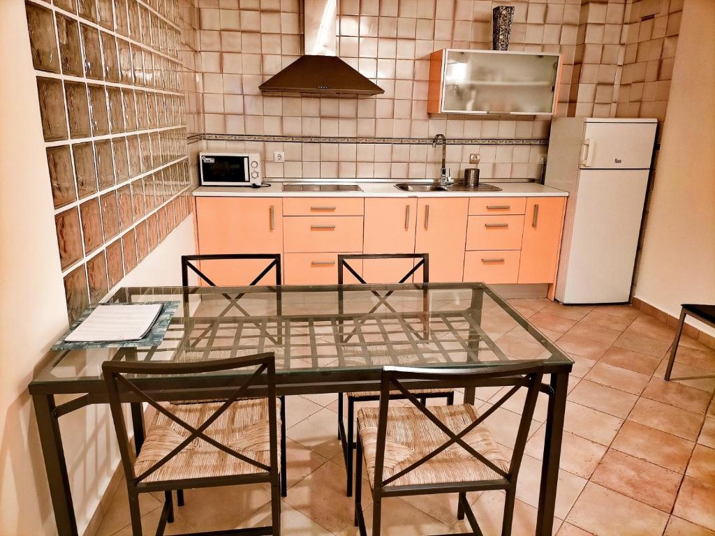 Kuchyň nebo kuchyňský kout v ubytování Abadia Suites
