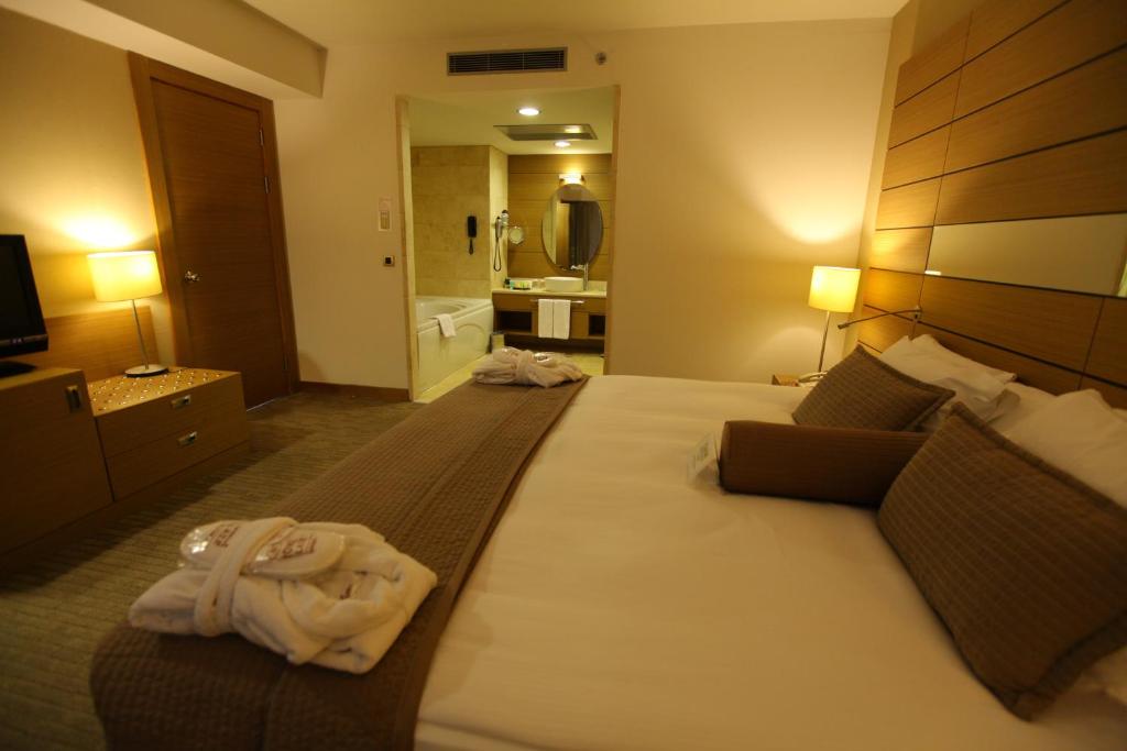 Postel nebo postele na pokoji v ubytování CPAnkara Hotel