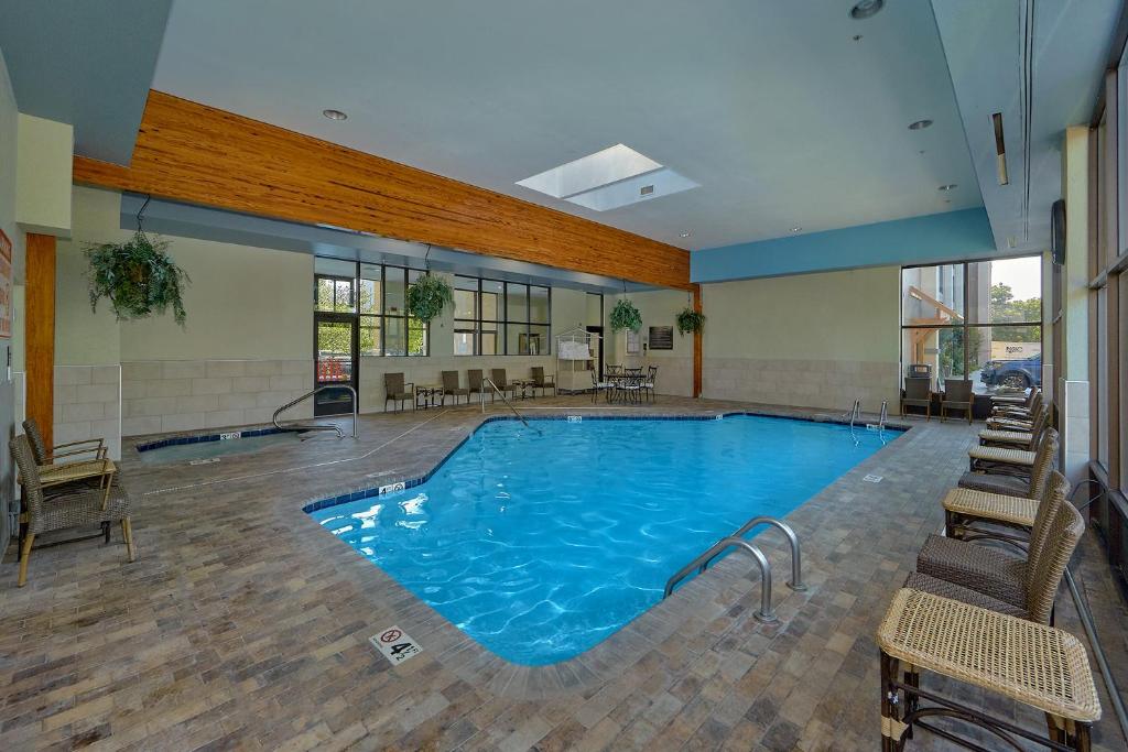 a large swimming pool in a hotel room at The Inn On The River in Pigeon Forge