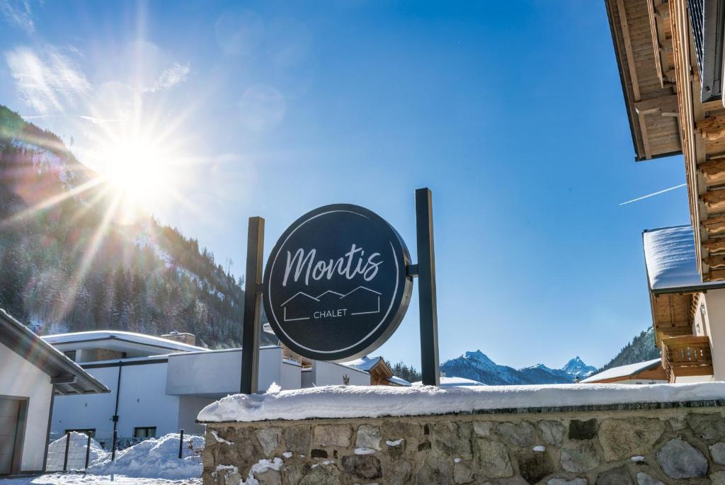 a sign for a mountain cafe in the snow at CHALET MONTIS in Flachau