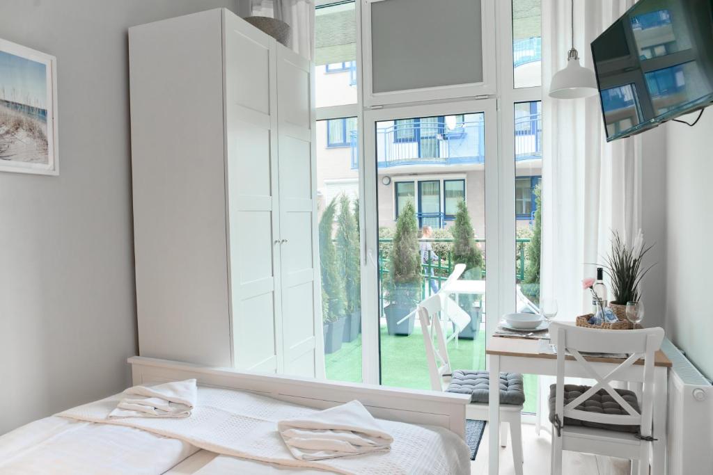 Postel nebo postele na pokoji v ubytování Portofino Seaside Apartments