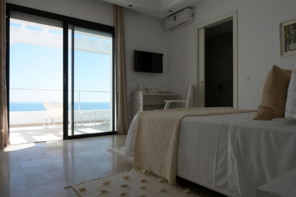 Voodi või voodid majutusasutuse Dar Corniche La Marsa (Adults Only) toas