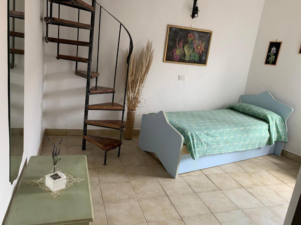 Postel nebo postele na pokoji v ubytování Casa di Giulietta