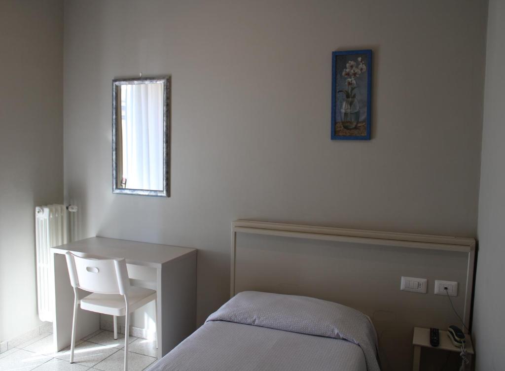 Postel nebo postele na pokoji v ubytování Hotel Delfina